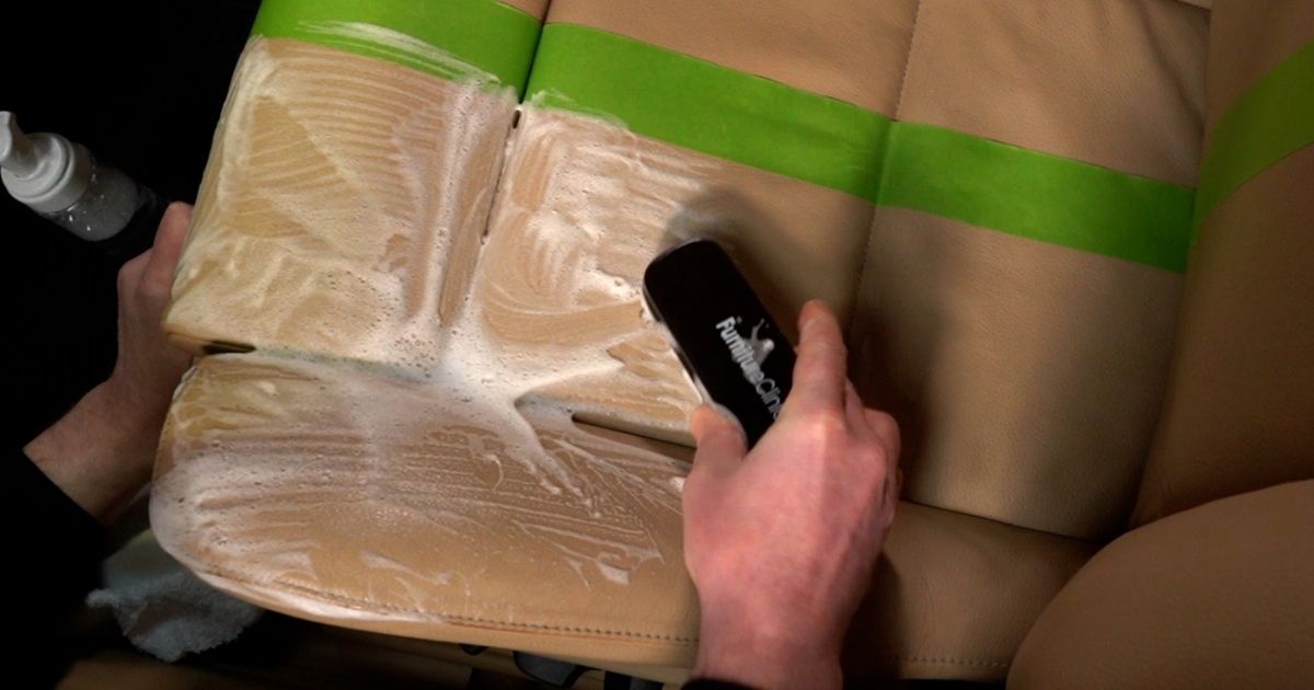 Cleaning of a leather car seat Using a soft bristled brush to clean car seats